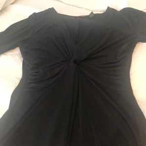 Black shirt with twist design in front.